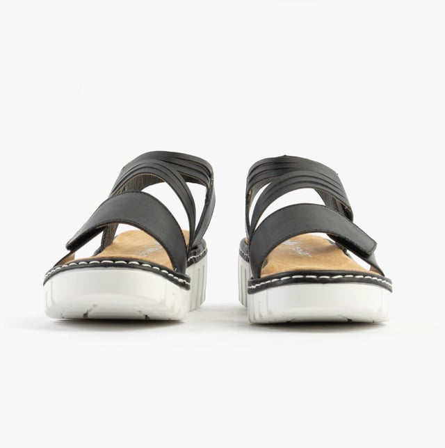 These women's open-toe wedge sandals feature a synthetic upper, breathable textile lining, and a RIRICON sole. Low heel height offers comfort for casual wear