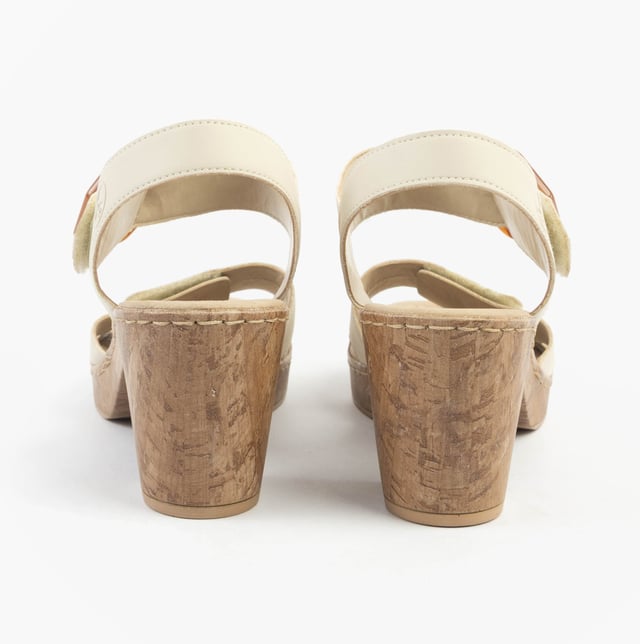 These women's open-toe sandals feature a synthetic upper, breathable lining, and a comfortable block heel. Ideal for casual wear with a relaxed fit and easy touch fasten closure