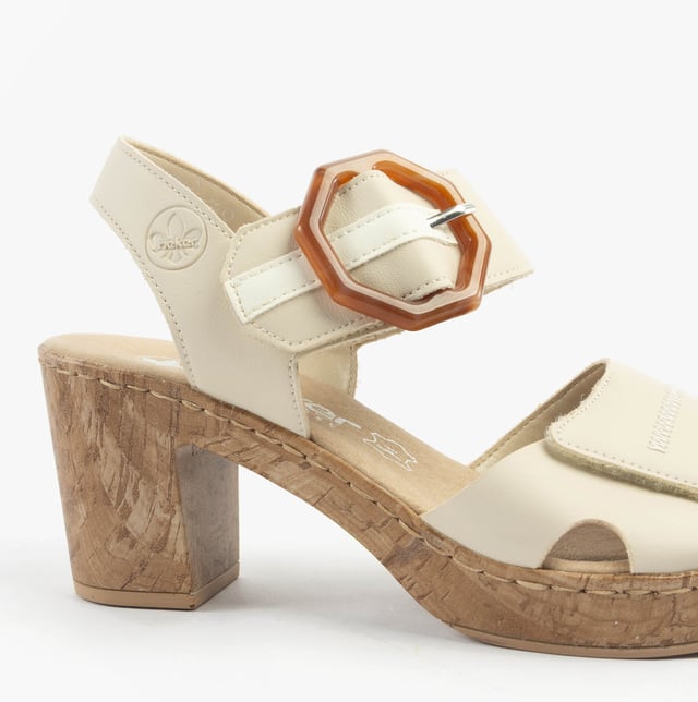 These women's open-toe sandals feature a synthetic upper, breathable lining, and a comfortable block heel. Ideal for casual wear with a relaxed fit and easy touch fasten closure