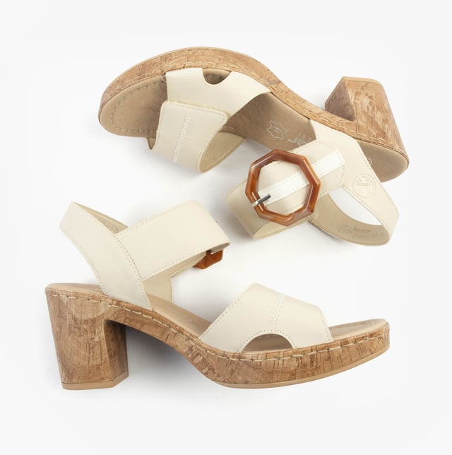 These women's open-toe sandals feature a synthetic upper, breathable lining, and a comfortable block heel. Ideal for casual wear with a relaxed fit and easy touch fasten closure