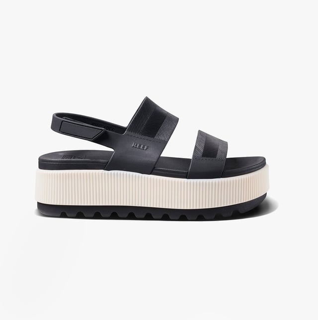 These open-toe women's sandals feature a synthetic upper, EVA lining and sole, a low platform heel, and a touch fasten closure, offering comfortable casual wear