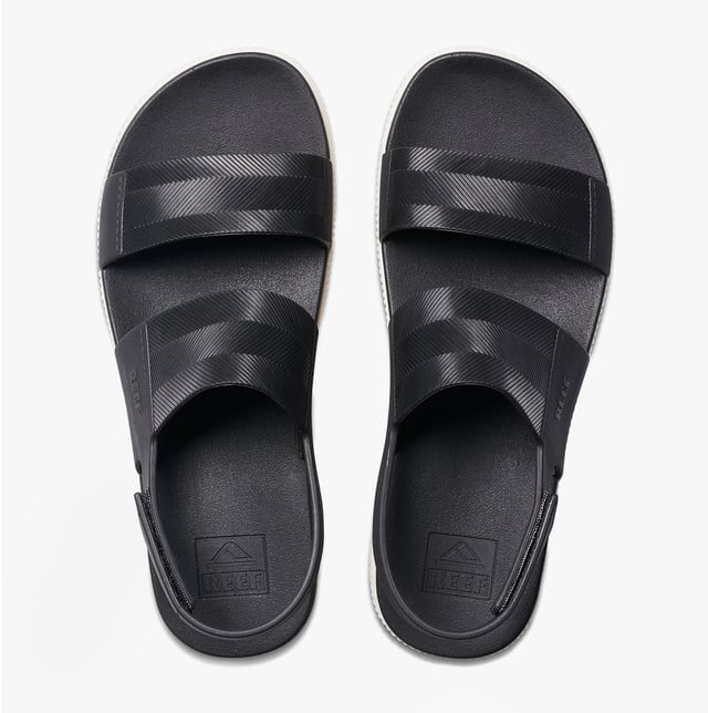 These open-toe women's sandals feature a synthetic upper, EVA lining and sole, a low platform heel, and a touch fasten closure, offering comfortable casual wear