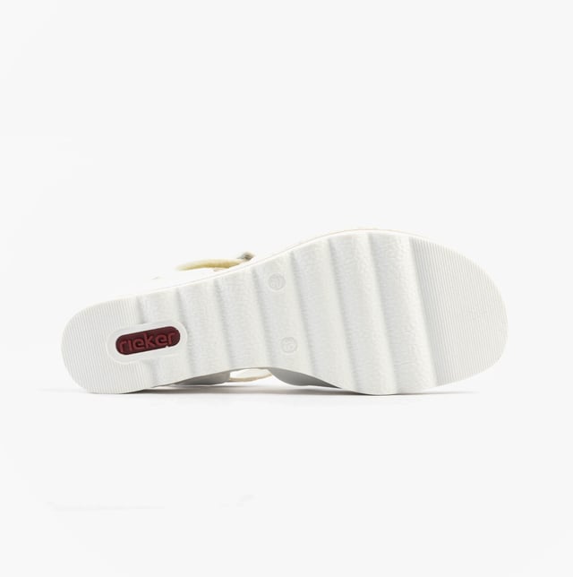 These women's wedge sandals feature a synthetic upper, breathable textile lining, and a PU sole for comfort. Ideal for casual wear with a relaxed fit and secure buckle closure