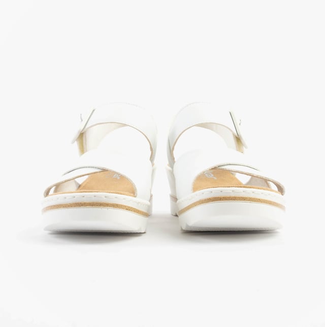 These women's wedge sandals feature a synthetic upper, breathable textile lining, and a PU sole for comfort. Ideal for casual wear with a relaxed fit and secure buckle closure