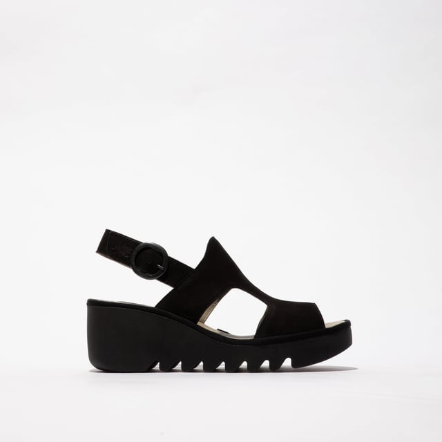 These open-toe wedge sandals feature a leather upper and lining with a TPR sole, offering comfort and breathability for casual wear