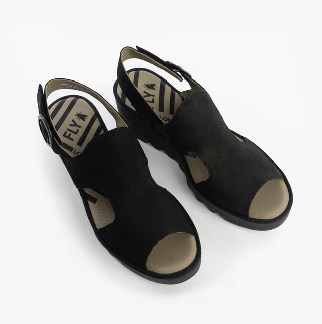 These open-toe wedge sandals feature a leather upper and lining with a TPR sole, offering comfort and breathability for casual wear