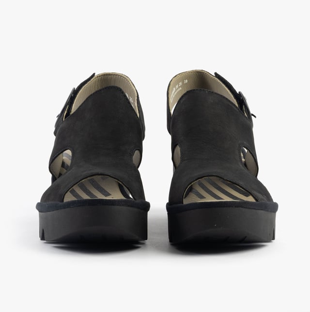 These open-toe wedge sandals feature a leather upper and lining with a TPR sole, offering comfort and breathability for casual wear
