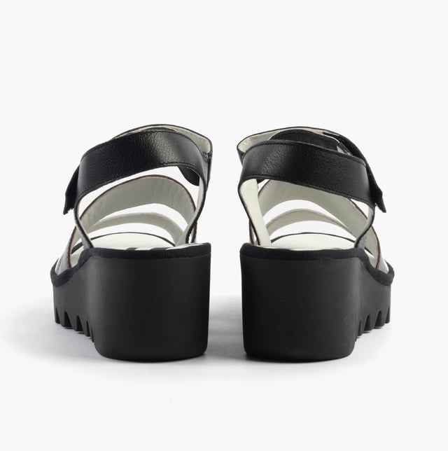 Open-toe wedge sandals crafted from breathable leather with a rubber sole and touch fasten, offering casual comfort for everyday wear