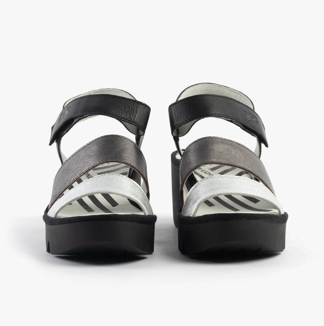 Open-toe wedge sandals crafted from breathable leather with a rubber sole and touch fasten, offering casual comfort for everyday wear