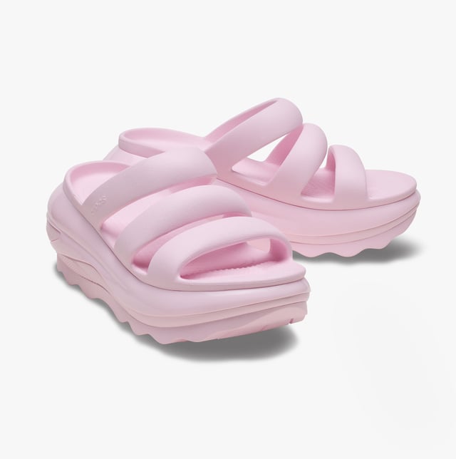 These women's open-toe sliders feature Croslite lining and sole, a platform heel, and a triple strap design, offering casual comfort for everyday wear