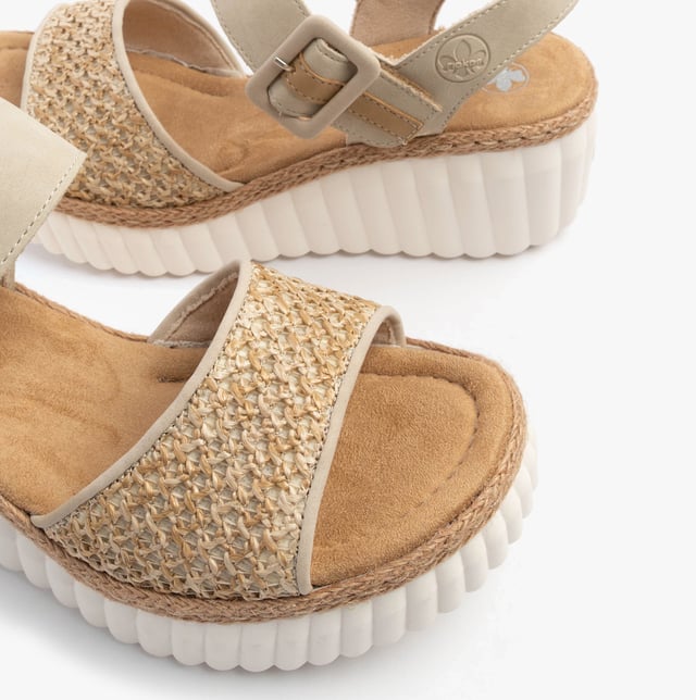 These women's wedge sandals feature a synthetic upper, textile lining, and RIRICON sole, offering comfort and an open toe design, ideal for casual wear