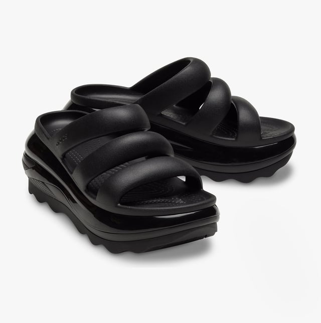 These women's slip-on sliders feature Croslite material for comfort and breathability, a platform heel, and an open toe design, ideal for casual wear