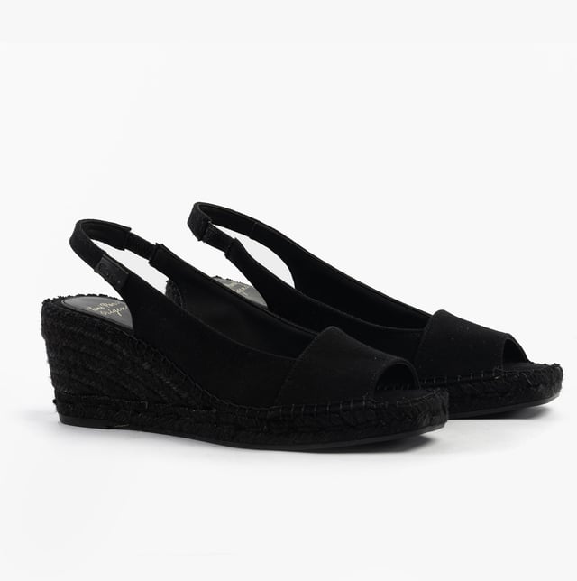 These women's slip-on sandals feature a textile upper and lining, rubber sole, low wedge heel, and open toe design, offering comfort and vegan-friendly style for casual wear