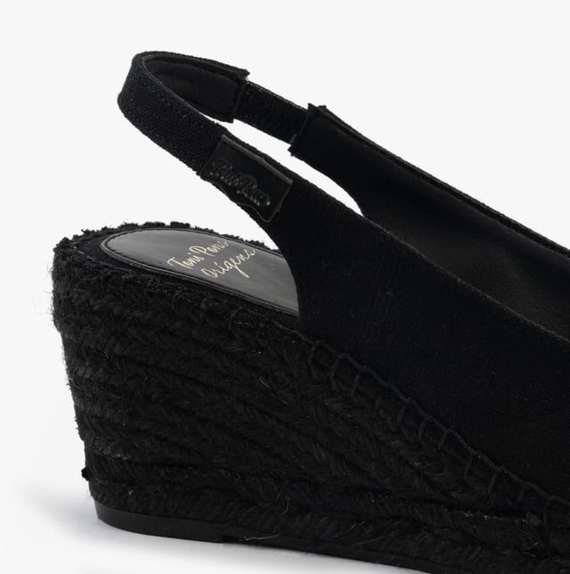 These women's slip-on sandals feature a textile upper and lining, rubber sole, low wedge heel, and open toe design, offering comfort and vegan-friendly style for casual wear
