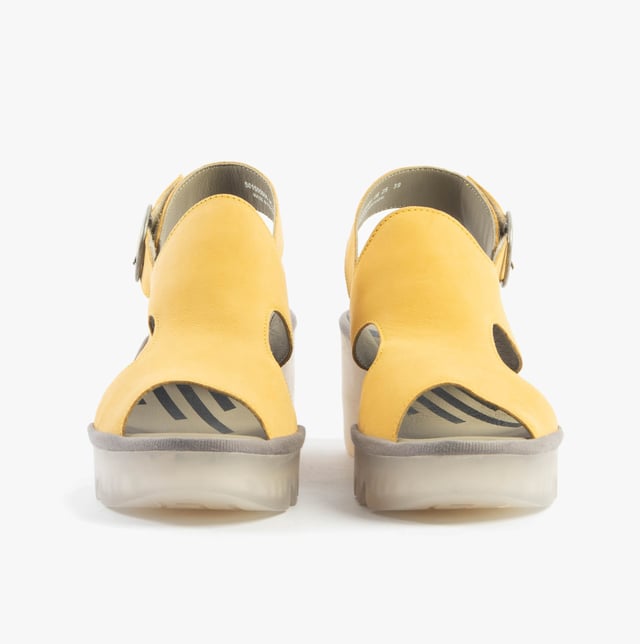 These open-toe wedge sandals feature a leather upper and lining with a breathable design, a TPR sole, and buckle closure, offering comfort for casual wear
