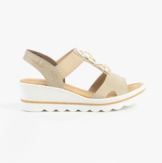 These women's wedge sandals feature a synthetic upper, breathable textile lining, and a slip-on design. Lightweight and comfortable, ideal for casual warm-weather wear