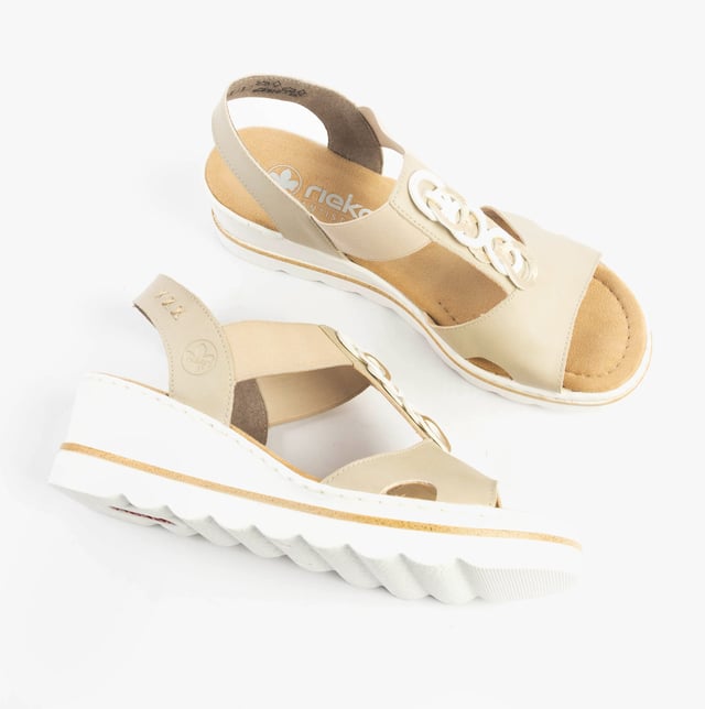 These women's wedge sandals feature a synthetic upper, breathable textile lining, and a slip-on design. Lightweight and comfortable, ideal for casual warm-weather wear
