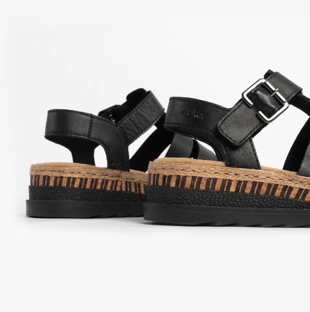 These women's open-toe wedge sandals feature coated leather uppers, breathable lining, and a PU sole, offering comfort and a secure buckle closure for casual wear