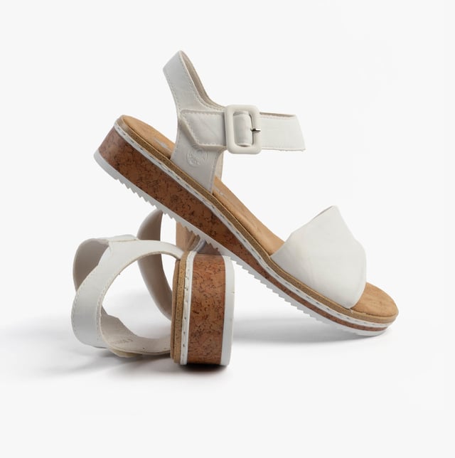 These women's open-toe wedge sandals feature a synthetic upper, breathable lining, and a RIRICON sole for comfort. Ideal for casual wear with a relaxed fit