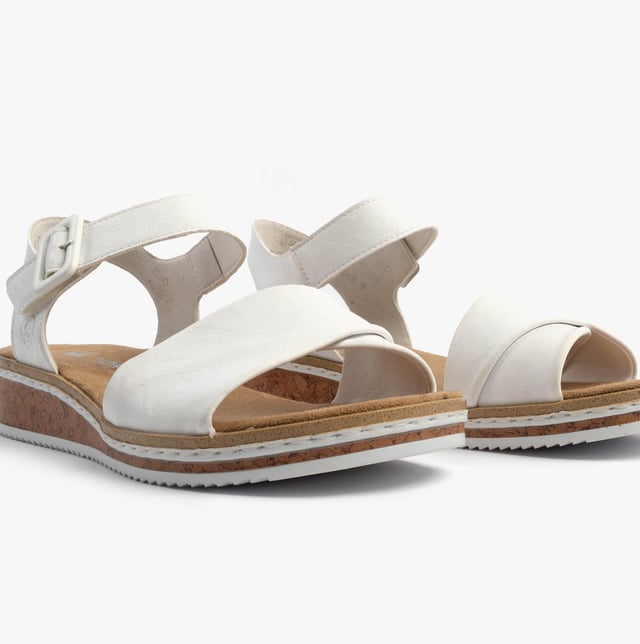These women's open-toe wedge sandals feature a synthetic upper, breathable lining, and a RIRICON sole for comfort. Ideal for casual wear with a relaxed fit