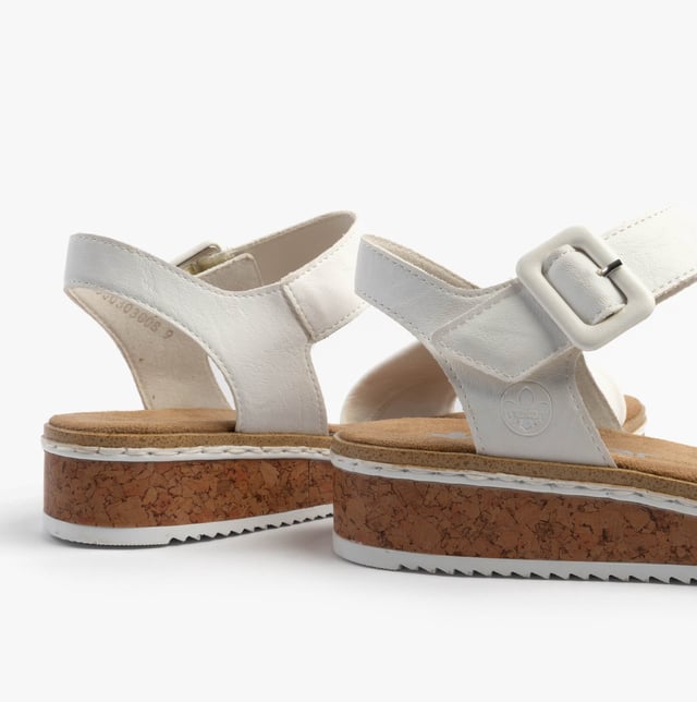 These women's open-toe wedge sandals feature a synthetic upper, breathable lining, and a RIRICON sole for comfort. Ideal for casual wear with a relaxed fit