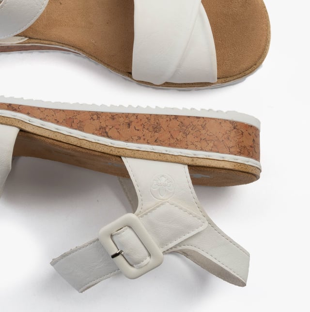These women's open-toe wedge sandals feature a synthetic upper, breathable lining, and a RIRICON sole for comfort. Ideal for casual wear with a relaxed fit