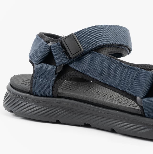 Upper textile with synthetic lining and sole, open toe design, touch fasten closure, relaxed width, flat heel, and comfort features make these men's casual sandals ideal for everyday wear