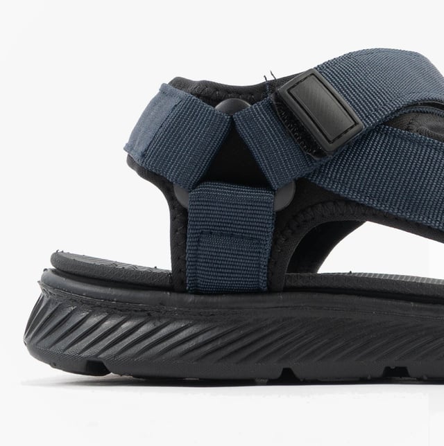 Upper textile with synthetic lining and sole, open toe design, touch fasten closure, relaxed width, flat heel, and comfort features make these men's casual sandals ideal for everyday wear