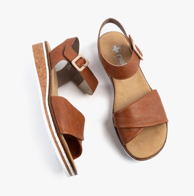 These women's open-toe wedge sandals feature a synthetic upper, breathable lining, and a RIRICON sole for comfort and casual wear