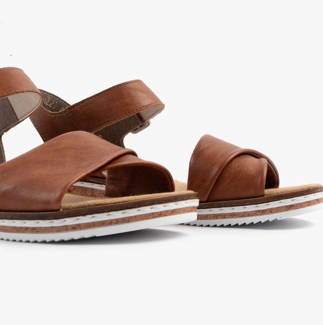 These women's open-toe wedge sandals feature a synthetic upper, breathable lining, and a RIRICON sole for comfort and casual wear