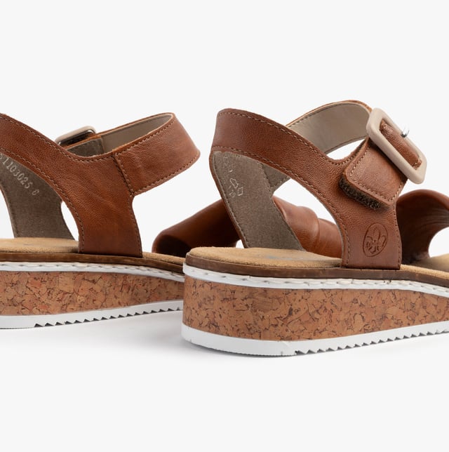 These women's open-toe wedge sandals feature a synthetic upper, breathable lining, and a RIRICON sole for comfort and casual wear