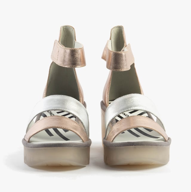 These open-toe wedge sandals feature a leather upper and lining with a TPR sole, offering breathable comfort. Ideal for casual wear and easy to slip on with touch fasten closure