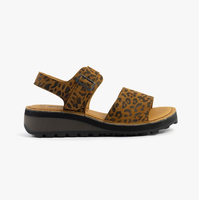 These open-toe wedge sandals feature a leather upper and lining with a TPR sole, offering comfort and breathability for casual wear