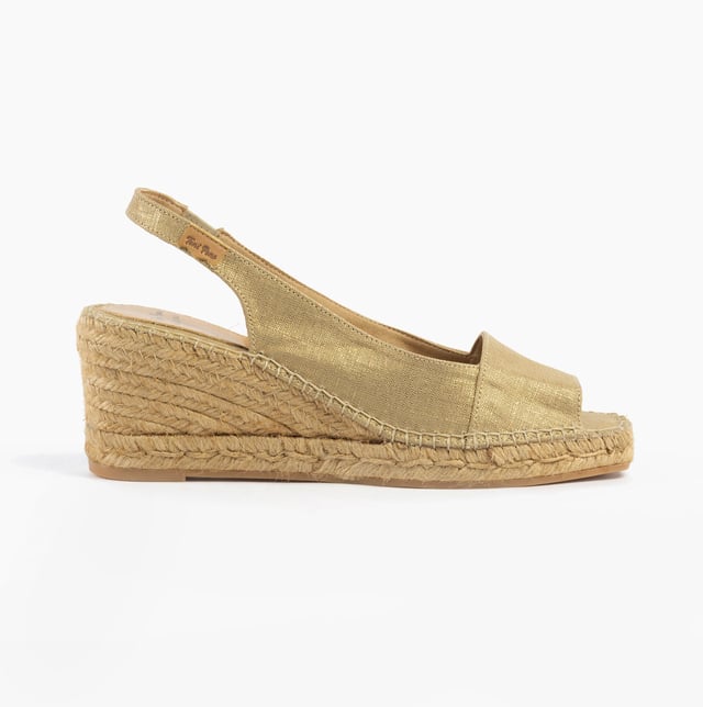 These slip-on wedge sandals feature a textile upper and lining with a rubber sole, offering comfort and vegan-friendly design, perfect for casual wear
