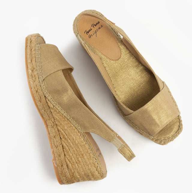 These slip-on wedge sandals feature a textile upper and lining with a rubber sole, offering comfort and vegan-friendly design, perfect for casual wear