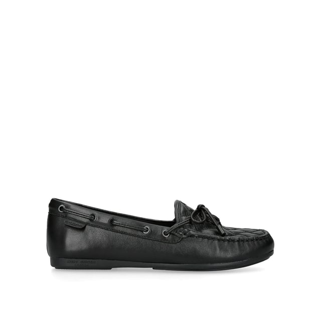 The Eagle Moccasin from Kurt Geiger is crafted from a black leather in an all-drench design. The toe features an overstitched quilt and a black eagle head.