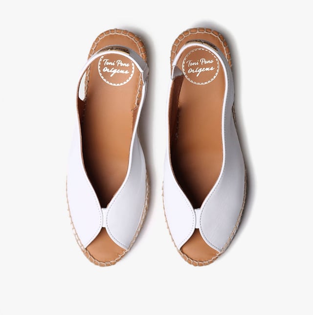 These women's espadrille sandals feature a leather upper and lining with a synthetic sole, a wedge heel, and slip-on design, offering comfort and breathability for casual wear