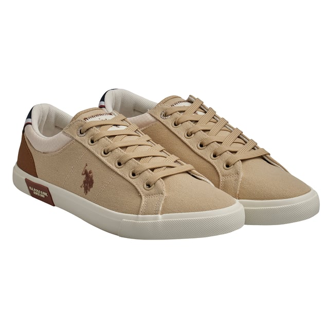 These US Polo Assn. sneakers combine casual style and everyday comfort. With a versatile design and iconic brand details, they're ideal for a relaxed look without losing personality.\n\n Details:\n - Durable canvas upper with reinforcements in key areas; some models come with leather, synthetic leather, and suede combination uppers.\n - Padded textile inner lining for greater comfort.\n - Flat laces and metal eyelets for a secure fit.\n - Non-slip rubber sole with institutional detail on the side.\n - Logo on the side as a distinctive seal.\n\n A comfortable and timeless option for those looking for lightweight footwear with a sporty style and urban essence. These men's casual sneakers are perfect for completing a casual look with the authentic seal of the US Polo Association.\n Composition: Exterior: Leather, Textile, Suede; Interior: Textile; Sole: Synthetic\n Care:\nClean with a soft brush and neutral soap.\n Avoid machine washing.\n Air dry, away from direct sunlight.