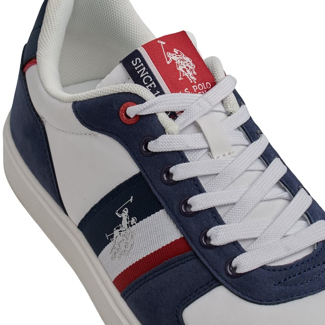 Inspired by the heritage of American casual style, designed for everyday use.

 US Polo Assn. men's sneakers fuse clean lines with functional details, resulting in versatile footwear with an urban spirit.

 Details:
 - Smooth upper with high-quality synthetic finishes that offer a polished and elegant appearance.
 -Side reinforcements with marked seams for greater structure and durability.
 -Interior lined with light padding, providing all-day comfort.
 -Flat laces in matching tone for a classic and secure fit.
 -Rubber sole with non-slip pattern, perfect for a firm step in urban environments.
 -Embroidered logo on the side and tongue label, reflecting the US Polo Assn. identity.

 An essential design for those seeking simplicity with character. These men's sneakers reinterpret casual elegance with iconic brand details, becoming a versatile staple for the contemporary menswear wardrobe.
 Composition: Exterior: Textile, Synthetic; Interior: Textile; Sole: Synthetic
 Care:
Clean with a soft brush and neutral soap.
 Avoid machine washing.
 Air dry, away from direct sunlight.