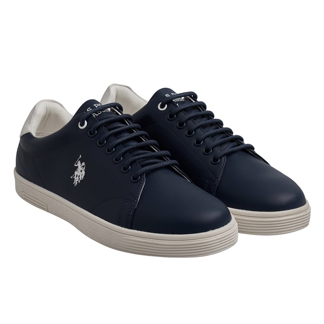 Refined style with the authenticity of leather.\n\n These leather sneakers from the US Polo Association combine a clean design with high-quality materials for a stylish urban look. Designed for those who value comfort without sacrificing style, they're the perfect complement to any casual outfit.\n\n Details:\n - Upper made of genuine leather, with a smooth finish and defined seams.\n - Soft inner lining with ergonomic padding.\n - Round laces with metal eyelets.\n - Durable rubber sole with non-slip texture.\n - US Polo Assn. logo engraved on the side.\n\n A timeless staple elevated by the use of genuine leather, these men's casual sneakers offer a perfect combination of comfort, durability, and refined style. Ideal for those who value real quality in their everyday footwear.\n Composition: Exterior: 100% Leather; Interior: Textile; Sole: Synthetic\n Care:\nClean with a soft brush and neutral soap.\n Avoid machine washing.\n Air dry, away from direct sunlight.
