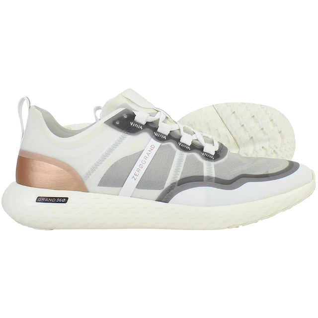 Engineered for performance and styled for versatility, the Cole Haan ZERØGRAND Outpace Women’s Running Shoes in White deliver responsive comfort, lightweight agility, and a clean, modern silhouette. Whether you're racking up miles or heading into your day, these trainers are built to move with you—effortlessly and in style.
Key Features
Breathable Mesh Upper

Lightweight and flexible with enhanced airflow to keep feet cool and comfortable through workouts or daily wear.

ZERØGRAND Cushioned Midsole

Advanced EVA midsole absorbs shock and adds bounce with every step, offering a plush ride on the go.

Stabilizing Internal Heel Counter

Supports the rear foot for better alignment and reduced fatigue during long runs or walks.

Durable Rubber Traction Pods

Strategically placed outsole rubber ensures grip and durability without adding excess weight.

Padded Collar and Tongue

Adds ankle comfort and reduces pressure points for a secure, supported feel.

Lace-Up Closure

Classic lacing system for an adjustable and snug fit.

All-White Colourway

Clean and versatile—pairs effortlessly with activewear, athleisure, or street-style outfits.

From morning jogs to afternoon errands, the Cole Haan ZERØGRAND Outpace Women’s White Running Shoes combine athletic performance with everyday wearability—designed to help you go further, faster, and in flawless style.