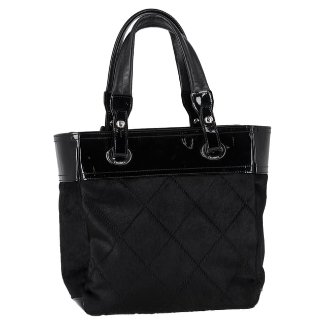 VINTAGE, RRP AS NEW
The Chanel Small Paris Biarritz Tote Bag in Black Calf Hair and Leather offers a perfect balance of luxury and functionality, featuring a chic combination of smooth leather and plush calf hair for a distinctive texture. Its compact size and structured shape make it an ideal choice for both everyday use and special occasions. Pair it with a tailored coat and boots for a sophisticated, city-ready look, or wear it with a casual dress and sneakers for a more relaxed yet elevated vibe. The timeless black color and signature Chanel design ensure it’s a versatile and statement piece in any wardrobe.

 Chanel Small Paris Biarritz Tote Bag in Black Calf Hair and Leather

Condition: Excellent
Signs of wear: No retail tag, No visible sign of wear., 
Packaging: None
Color: Black
Material: Calf hair
Size: One Size | One Size
Measurements: Width: 110; Height: 270; Length: 320; Handle drop: 190; Strap length: 0
SKU: NAPPUGBBA465190W