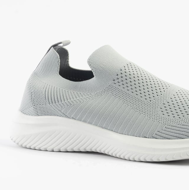 These casual women's slip-on shoes feature a textile upper, breathable lining, and rubber sole with a low heel, offering comfort and easy wear for everyday activities