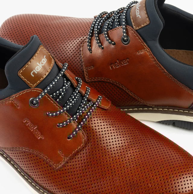 These casual men's shoes feature a leather and textile upper with a round toe, lace-up design, and TPE sole, offering comfort for everyday wear
