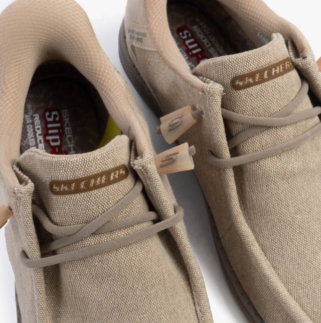 These casual men's shoes feature a canvas upper, textile lining, rubber sole, and slip-in design with air-cooled memory foam for comfort, suitable for everyday wear
