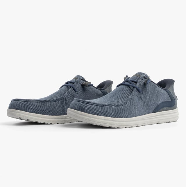 These casual men's shoes feature a canvas upper, rubber sole, and relaxed fit. Equipped with air-cooled memory foam and lace-up closure for comfort and easy wear