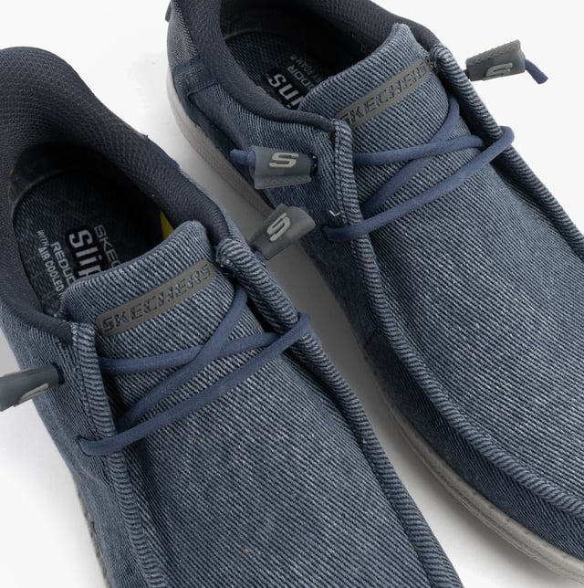 These casual men's shoes feature a canvas upper, rubber sole, and relaxed fit. Equipped with air-cooled memory foam and lace-up closure for comfort and easy wear