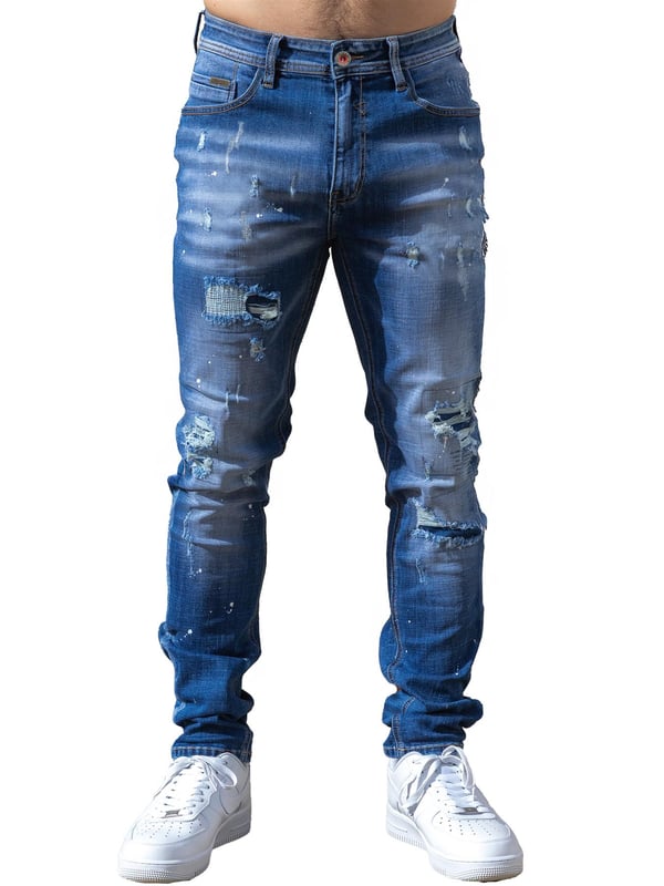 Enzo Milano | Mens Ripped Jeans Upgrade your denim game with the Enzo Milano slim fit Jeans for men, crafted for style and comfort. Featuring bold ripped and repaired detailing, these denim jeans deliver a rugged, contemporary look accentuated by unique paint splash accents. The tapered leg creates a modern silhouette, while premium stretch fabric ensures ease of movement and a perfect fit. A concealed zip fly fastening adds a clean finish, complemented by a classic 5-pocket design for everyday practicality. Finished with the signature Enzo Milano PU branded label at the back, these denim trousers embody high-quality craftsmanship and distinctive urban flair.