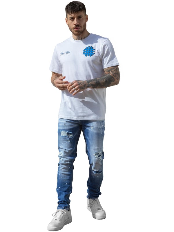 Enzo Milano | Mens Ripped Jeans Upgrade your denim game with the Enzo Milano slim fit Jeans for men, crafted for style and comfort. Featuring bold ripped and repaired detailing, these denim jeans deliver a rugged, contemporary look accentuated by unique paint splash accents. The tapered leg creates a modern silhouette, while premium stretch fabric ensures ease of movement and a perfect fit. A concealed zip fly fastening adds a clean finish, complemented by a classic 5-pocket design for everyday practicality. Finished with the signature Enzo Milano PU branded label at the back, these denim trousers embody high-quality craftsmanship and distinctive urban flair.