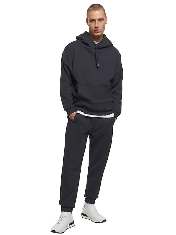 Expertly crafted for both casual and work wear, the Kruze Mens Tracksuit Set boasts unparalleled comfort and versatility. The crew neckline and long sleeves of the hoodie provide a timeless style, while the joggers feature an adjustable waistband and drawstrings for a perfect fit. Accompanied by side pockets and cuffed ankles, this set is ideal for any occasion. 52% Cotton, 48% Polyester. Available in Black, Grey and Navy colours.